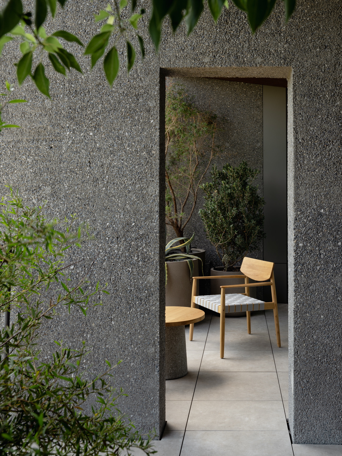 Stone garden room with a quiet seating alcove