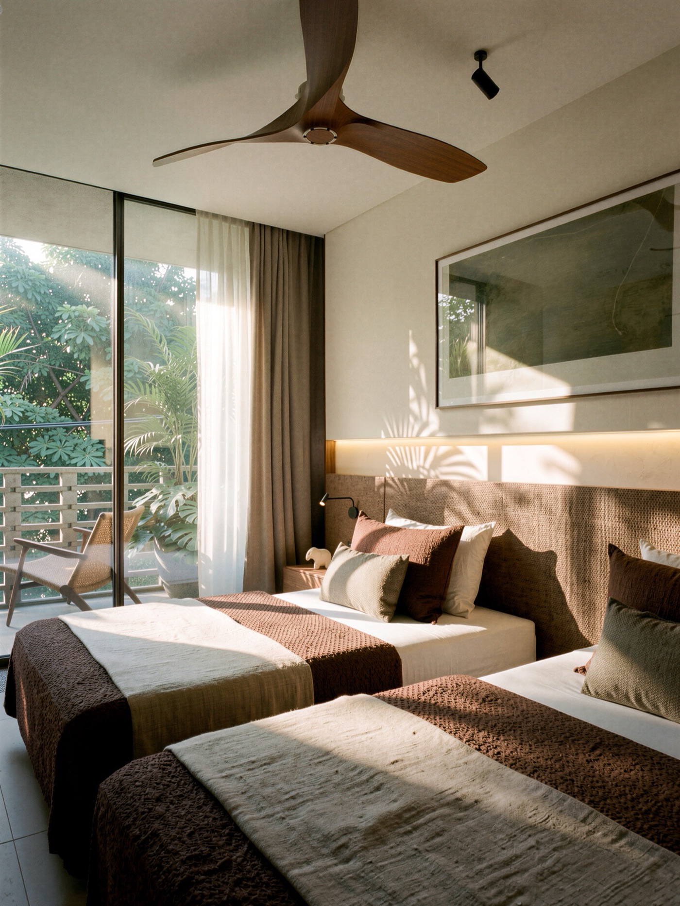 Warm twin bedroom with woven textiles and a garden balcony